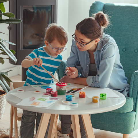 Mother or art therapist and child