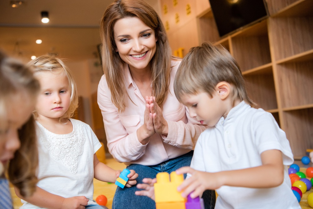 Happy Educator and adorable kids