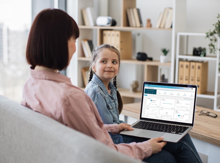 Mother with daughter ordering fast food